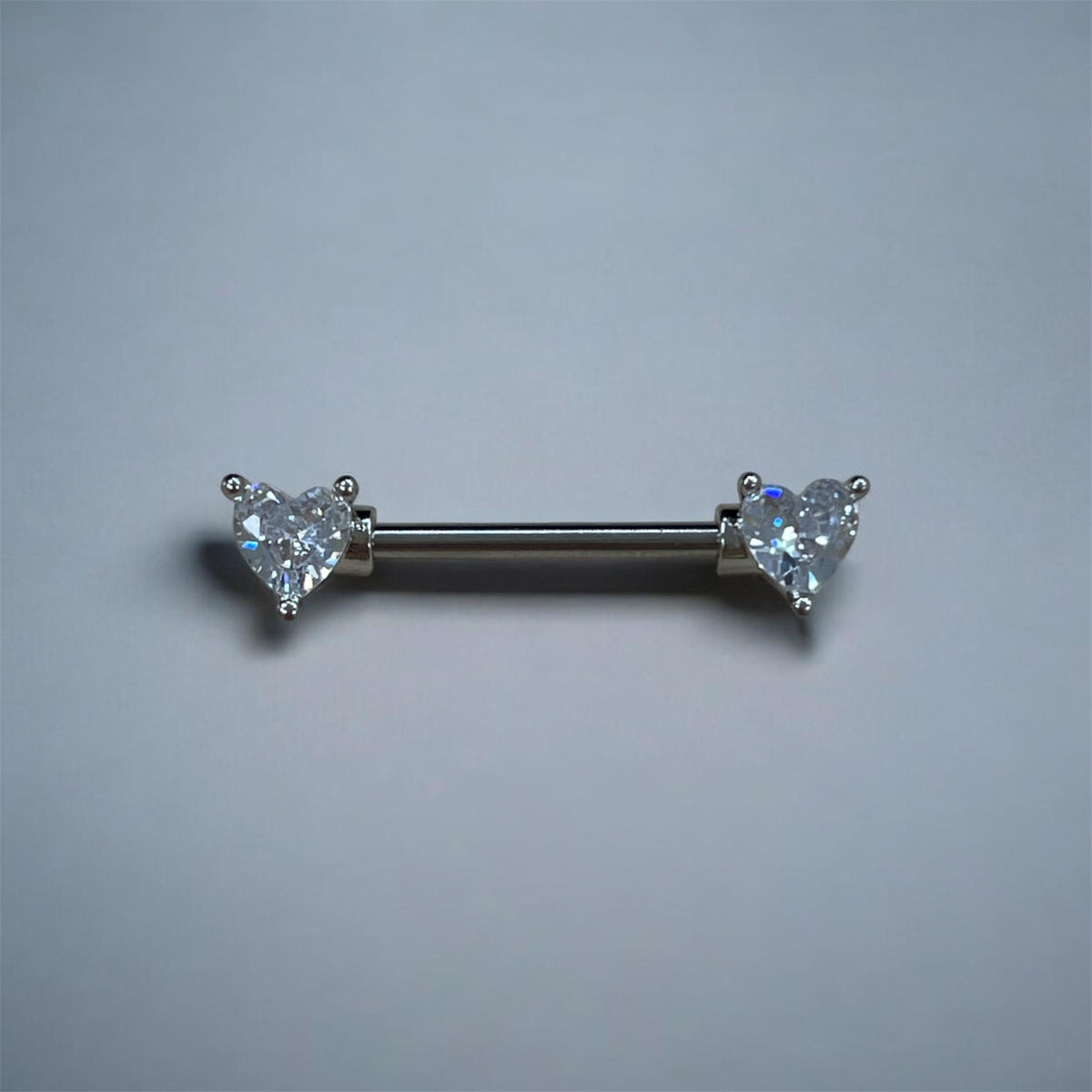 Piercing téton doré cœur en oxyde de zirconium
