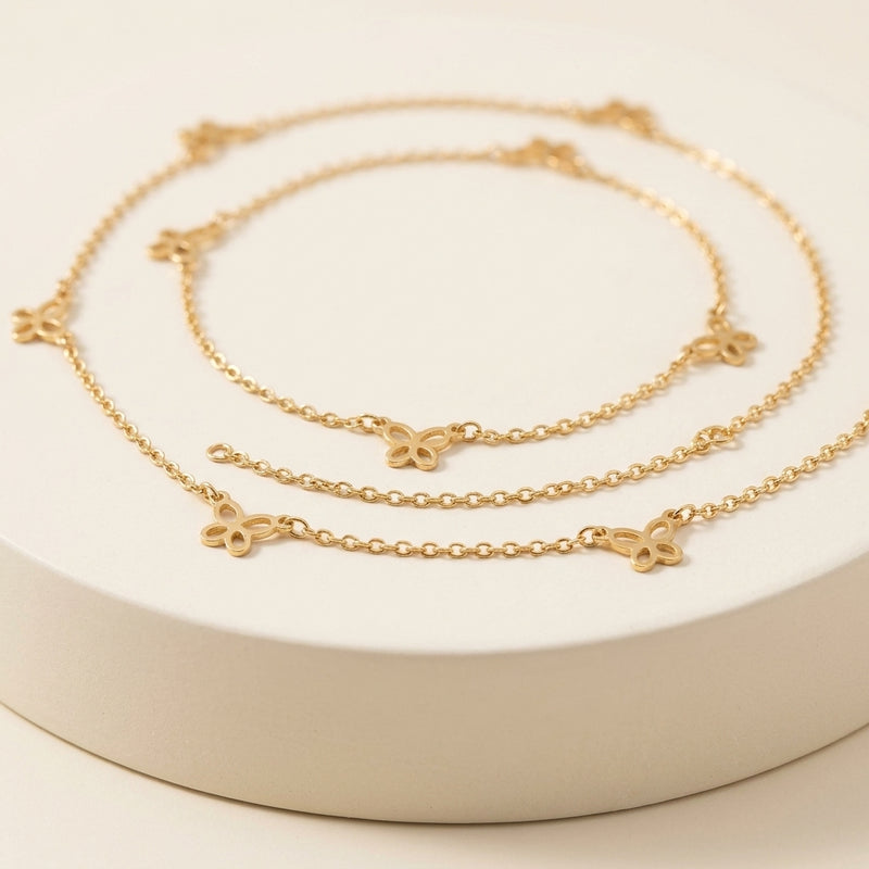 Chaîne de cheville dorée avec pampilles papillons en acier inoxydable - L'Arbre à Bijoux